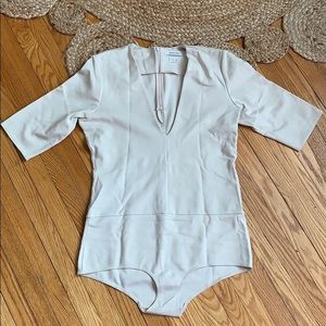 Babaton Cream 3/4 Sleeve Plunge Neck Bodysuit
